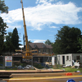 pre fabricated panels arrive on site and under being erected with a crane